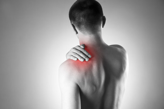 Man with pain in shoulder. Pain in the human body