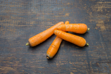 Carrots isolated on the old wood background
