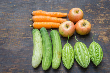 Vegetables isolated on wood background
