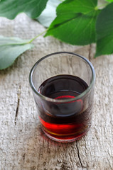 Small shot glass of alcoholic beverage or medical tincture