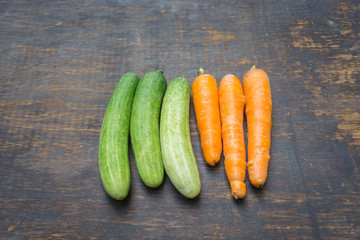 Group of vegetables isolated on a wood background
