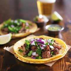 authentic mexican street tacos with barbacoa beef on yellow corn tortilla