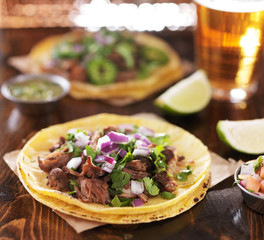 mexican beef barbacoa street tacos on soft yellow corn tortillas