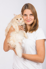 Girl hugging domestic cat