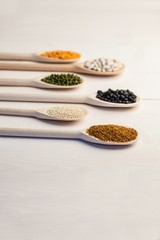 Wooden spoons of pulses and seeds