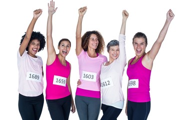 Cheerful athletes with arms raised 