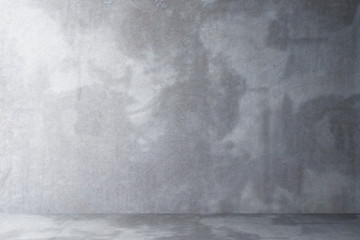 empty room with a floor and a wall of concrete