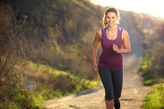 Beautiful attractive woman morning sunset sunrise jog walk hike outdoors exercise burning calories