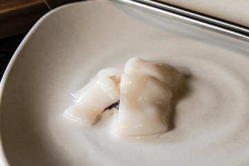 squid in a white dish and chopsticks for Grilled dishes