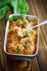 Cauliflower baked with  tomatoes
