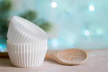 Christmas cupcake molds with wooden spoon and fir
