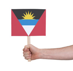 Hand holding small card - Flag of Antigua and Barbuda