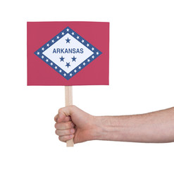 Hand holding small card - Flag of Arkansas