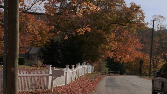 Country road with house in Autumn