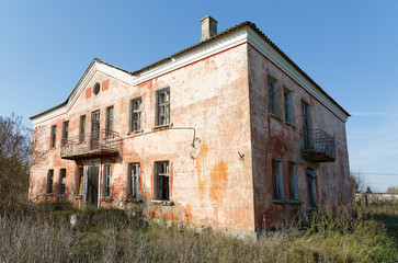 Fototapeta na wymiar old building with broken windows and doors