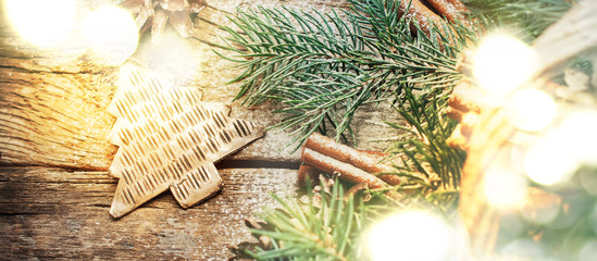 Fototapeta na wymiar Christmas Light with Bokeh and Metal Fir Tree Toy. Top view