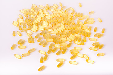 Fish oil capsules isolated on white, health care and medical