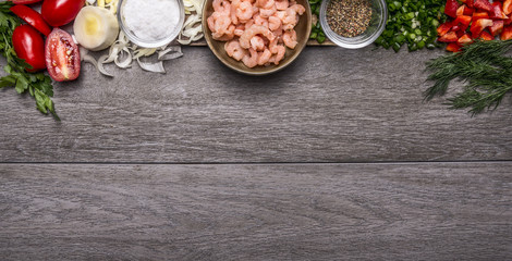 border with  shrimp with spices and vegetables and herbs on wooden background top view Banner for website 