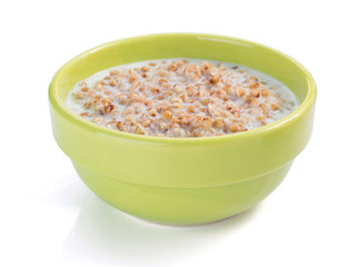 buckwheat in bowl isolated on white
