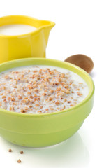 buckwheat in bowl isolated on white