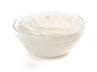 Obraz na płótnie Canvas sour cream in bowl on white