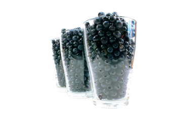 Glass full of ripe blueberries