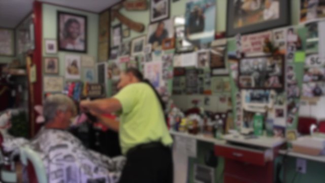 Man getting haircut at barbershop