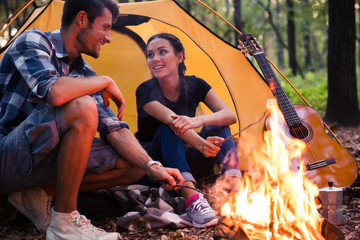 Portrait of a happy couple and bonfire