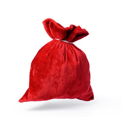 Flying Santa Claus red bag full, on white background. File contains a path to isolation. 