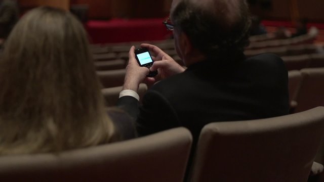 Businessman texting on cellphone