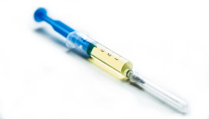 Syringe with a drug, medicine on a white background isolated