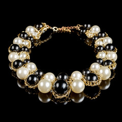 necklace on a black background

