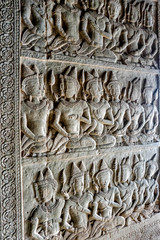 Ancient mural bas relief carving stone in Angkor Wat, Cambodia. 