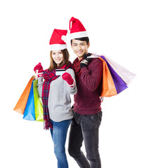 happy couple shopping together with christmas wear