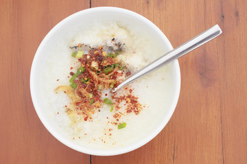 sea bass porridge in white bowl on wooden table
