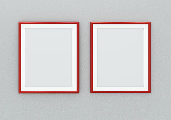 Blank red picture frames over grey wall