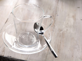 Clear glass mug and saucer