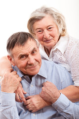 Closeup portrait of smiling elderly couple