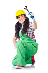 Female workman in green overalls holding key isolated on white