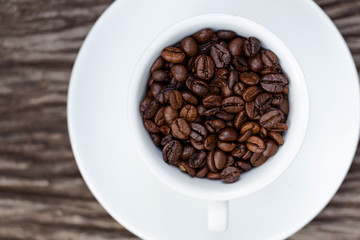 Coffee beans in cup
