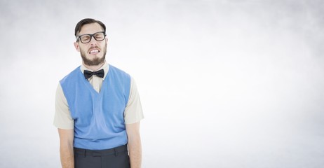 Composite image of geeky hipster pulling a silly face