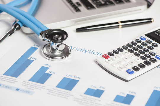 Stethoscope and financial papers