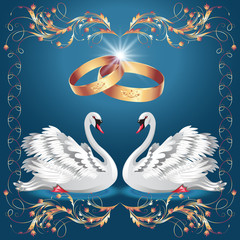 Card with wedding rings and two swans