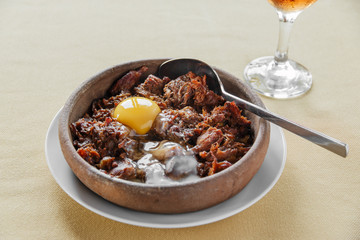 pieces of meat stewed in a clay bowl