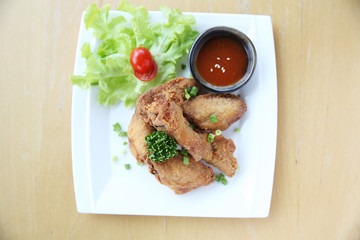Fried chicken on wood background