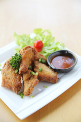 Fried chicken on wood background