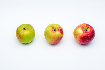 Three red yellow green apples isolated