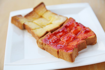grilled bread with starwberry jam and milk