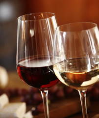 Elegant glasses of red and white wine