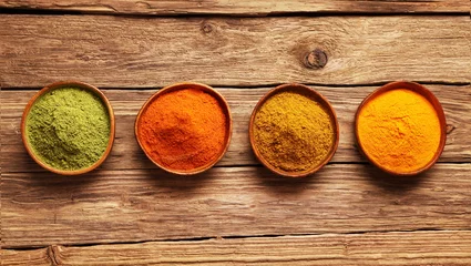 Poster Row of colorful spices in bowls © exclusive-design